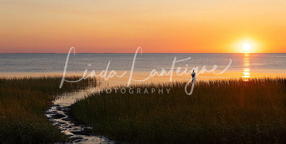 Fisherman at sunset on First Encounter Beach, Cape Cod